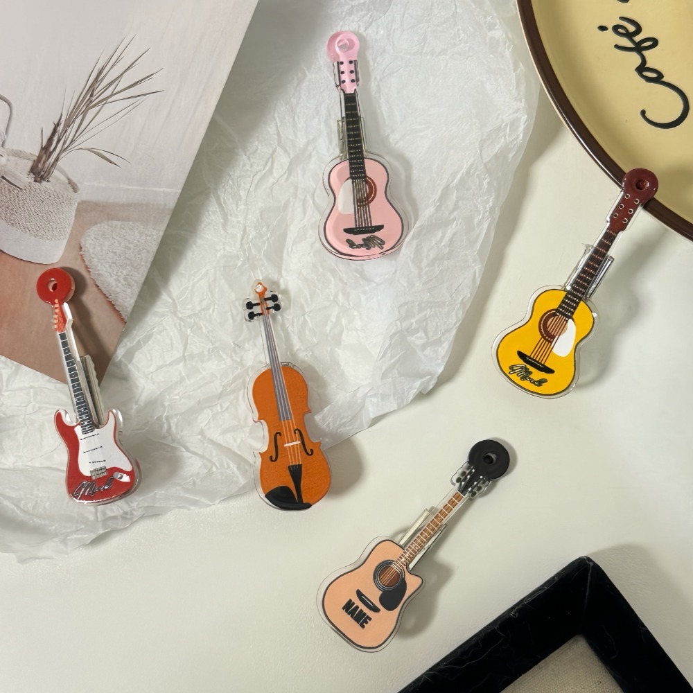 مشبك شعر على شكل كمان، تصميم ك - مراجعة Picture Of Musical Instrument وسعره